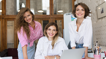 group young cheerful women with laptop