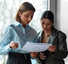 two girls analyzing graphs